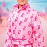 Barbie The Movie – Ken-Sammelpuppe, Ryan Gosling als Ken in rosafarbenem Overall mit „B“-Aufdruck, weißen Sneakern und bunten Inlineskates, JCP80